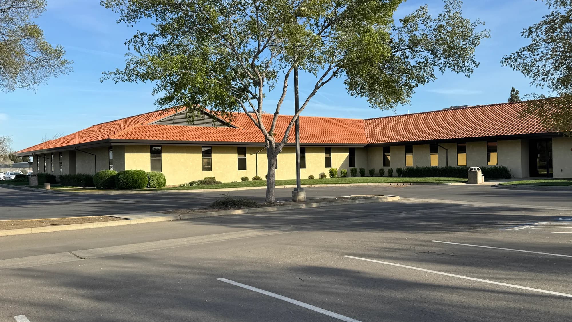 Exterior of the HSA Building office in Merced CA with solar-control window film on the window run
