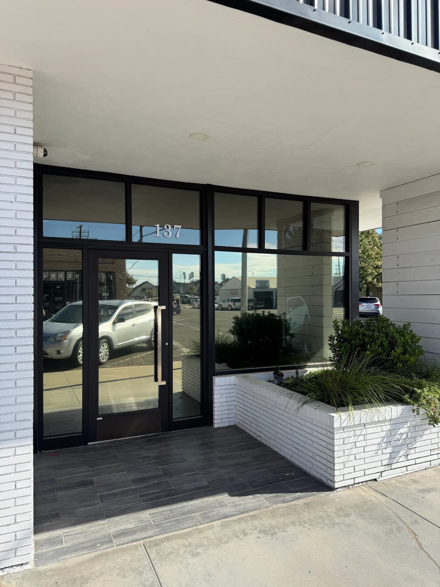 Tinted storefront entry glass at a behavioral health clinic in Atwater CA