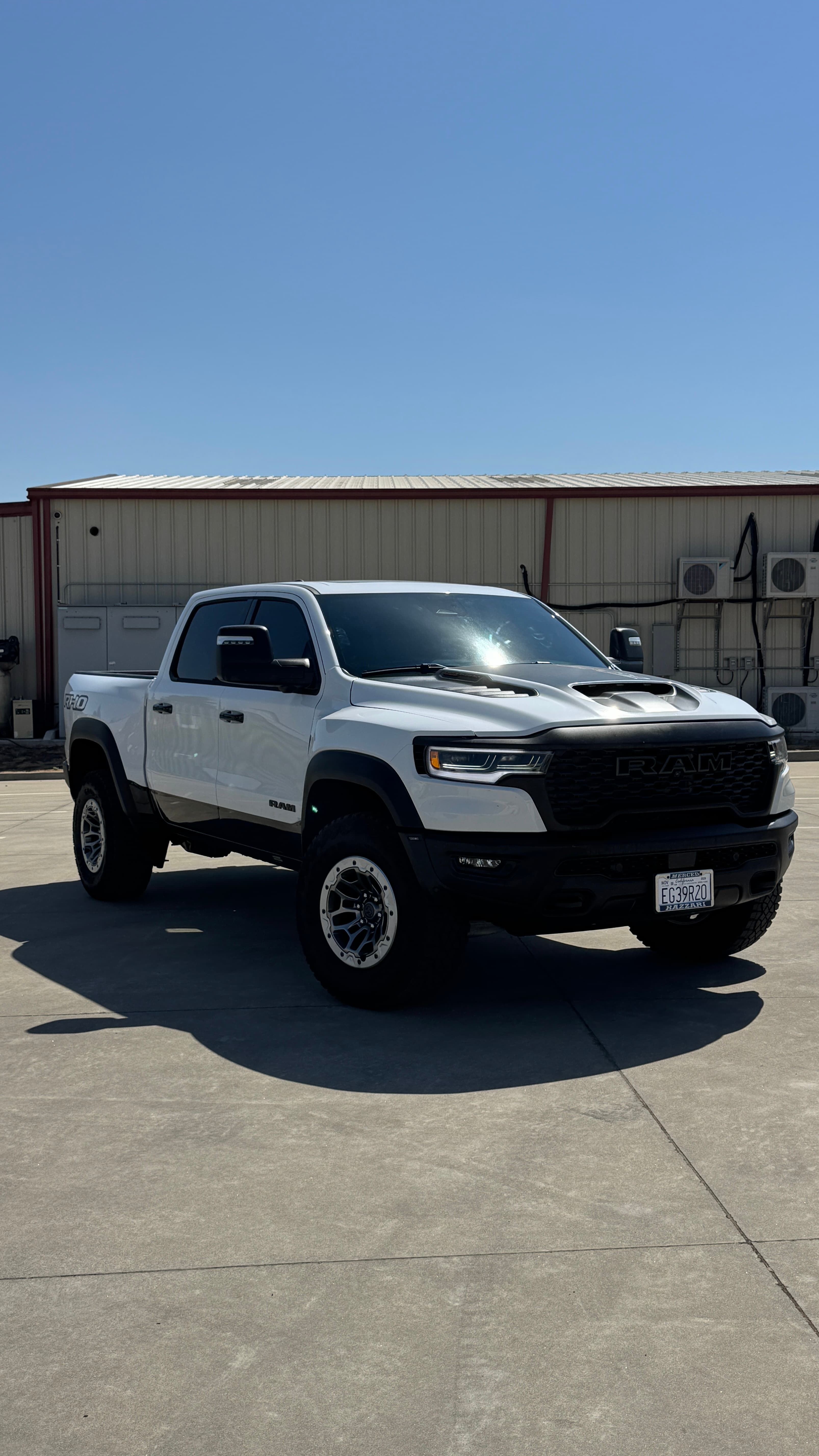 Paint protection film on white Ram front at Top Tier Tinting Atwater