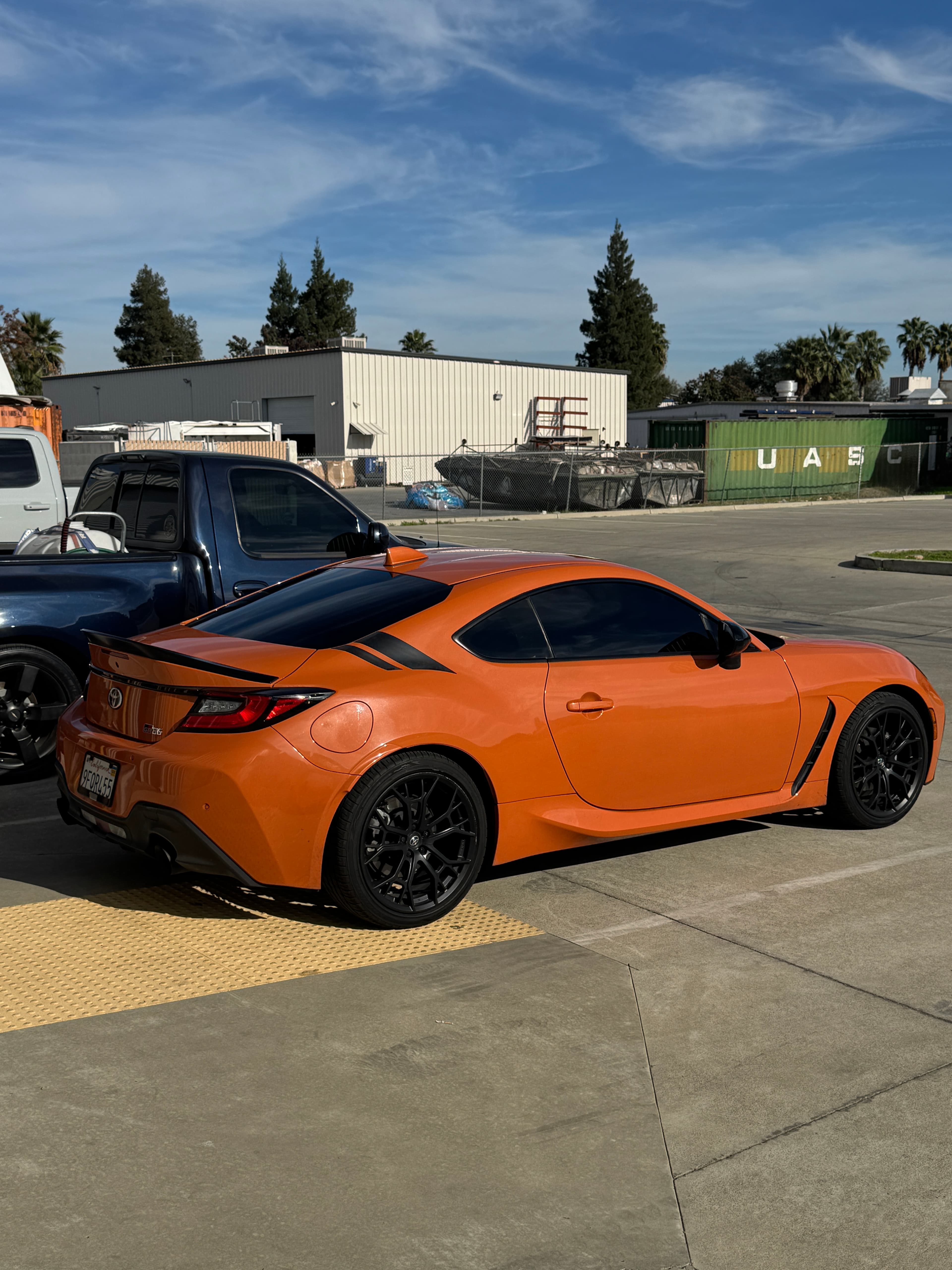 Toyota GR86 orange sports car with window tint in Merced County